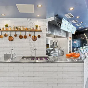 a view of the kitchen from the dining area