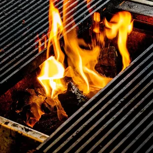 a grill with flames on it