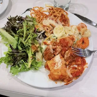 Salad, spaghetti, rigatoni with spicy sausage, and Alfredo tortellini