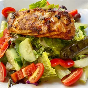 Grilled wild Salmon over Greek Salad