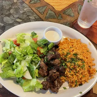 Lamb shish kabob, Arab salad, and spicy rice.