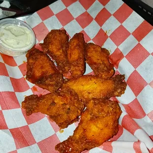 a plate of fried chicken wings