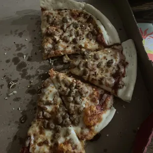 a half eaten pizza in a box