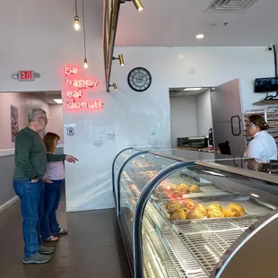 a man and a woman in a bakery