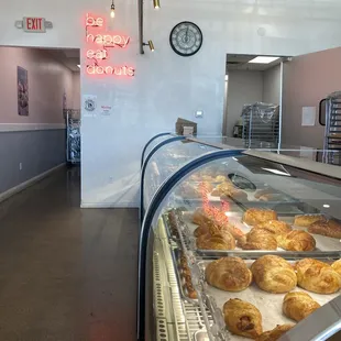 a bakery with a clock in the background