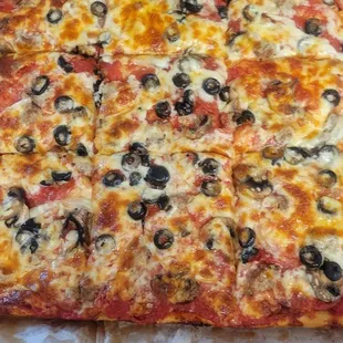 Mazzulli's Pizza half the family size is a combination and the otherside is mushrooms and cheese.