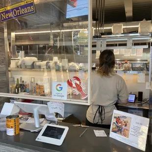 a woman ordering food at a restaurant