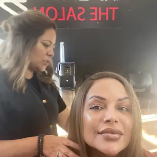 Stylist doing the final touches.