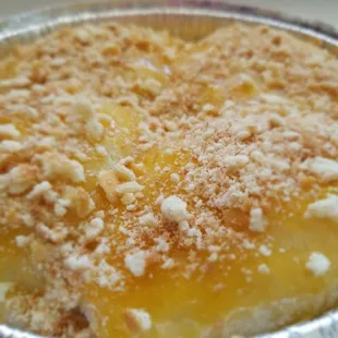 "Lilikoi Panipopo" Freshly baked lilikoi bread, baked in a dreamy coconut sauce.  Topped w/lilikoi glaze &amp; Nilla crumbles