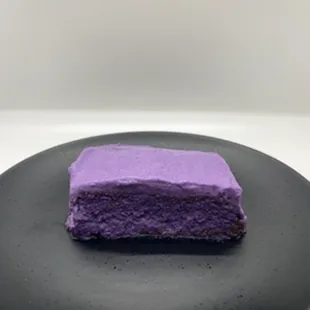 "Ube Tres Leches" Ube sponge cake soaked in coconut milk, heavy cream and condensed milk.  Topped w/an ube whipped cream.