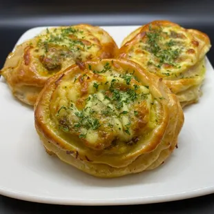 "Turkey Pesto Melt" Turkey, pesto and mozzarella baked in fresh bread.  Topped w/mayo &amp; parsley.