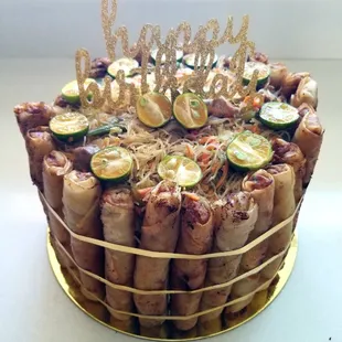 Pancit/Lumpia cake Bihon pancit surrounded with vegetable/pork lumpia.  Optional suprise pull can be filled with money, pictures, etc.
