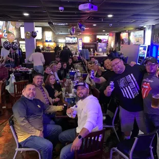 a group of people sitting around a table