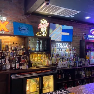 a bar with neon signs