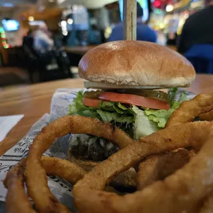 Almost World Famous 1/2 lb McNasty Burger with pepper jack cheese, onion rings, and a soda.