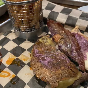 Flaming blueberry with fries; smoked Gouda cheese, applewood smoked bacon, blueberry habanero aioli sauce; bleu cheese crisp.