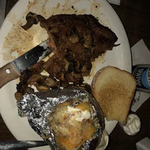 What's left of my ribeye with sautéed mushrooms.