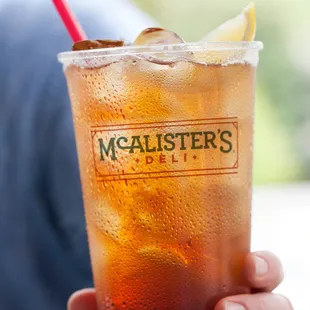 a person holding a drink