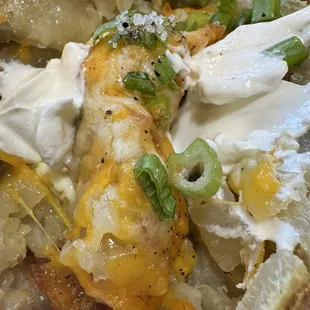 Spud oozing cheese