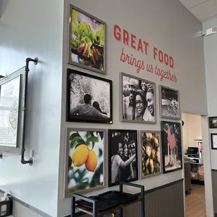 a wall of framed photographs