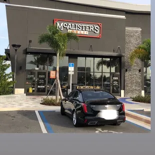 a car parked in front of the store