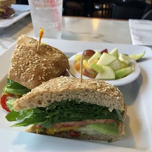 The Veggie on 9-grain ciabatta with a side of fruit.