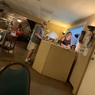a man and a woman in a kitchen