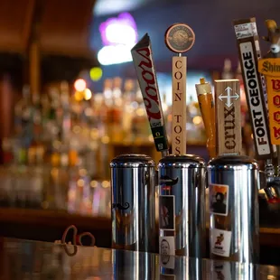 a row of beer taps