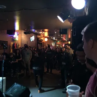 a crowd of people at a bar