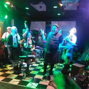 a band performing on a checkered floor