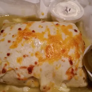 a burrito with a side of pickles