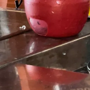 Old fly trap left on the bar with dead flies