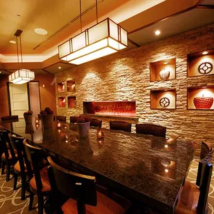 a dining room with a large table and chairs