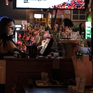 a woman sitting at a bar