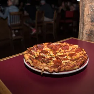 a pepperoni pizza on a plate