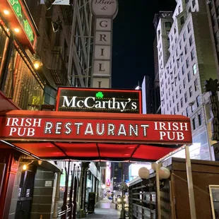 the neon sign for mccarthy's irish pub