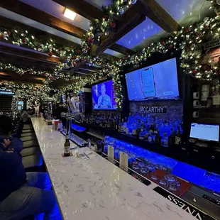 a bar with christmas lights