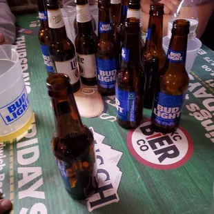 a table full of beer bottles