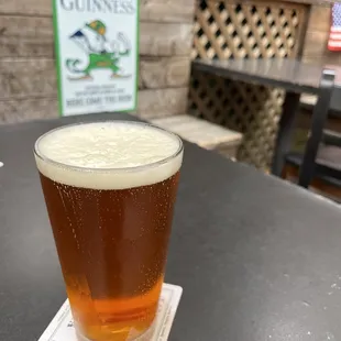 a glass of beer on a table