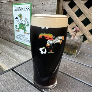 a pint of guinness on a table
