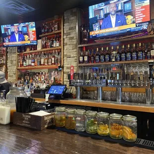 a bar with a man behind the bar