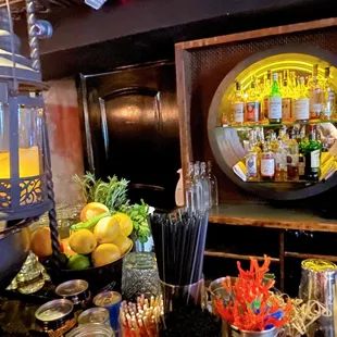 a bar with a variety of cocktails