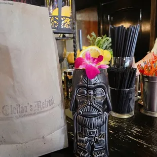 a tiki mug on a bar counter