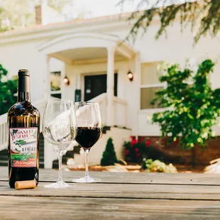 a bottle of wine and two glasses of wine