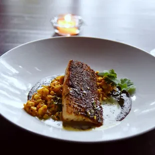 Sustainable Blackened Open Blue Cobia with fire-roasted corn salsa and black bean puree.
