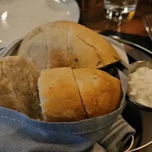 a basket of bread and dips