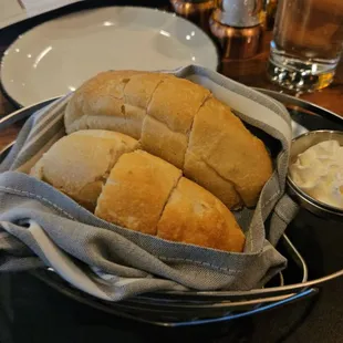 a basket of bread and dips