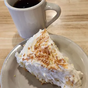 Tasty slice of coconut cream pie and a cup of coffee. Pie portion seemed small for the price, 1/8th of a pie instead of 1/6th slice.