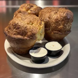 Freshly baked popovers with honey butter
