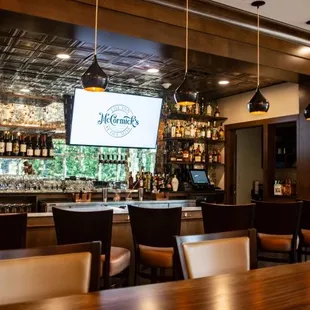 a bar with a large screen